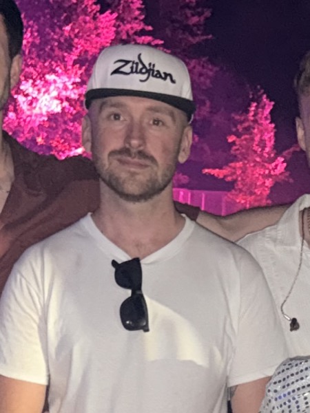 The band's drummer, photographed after a show