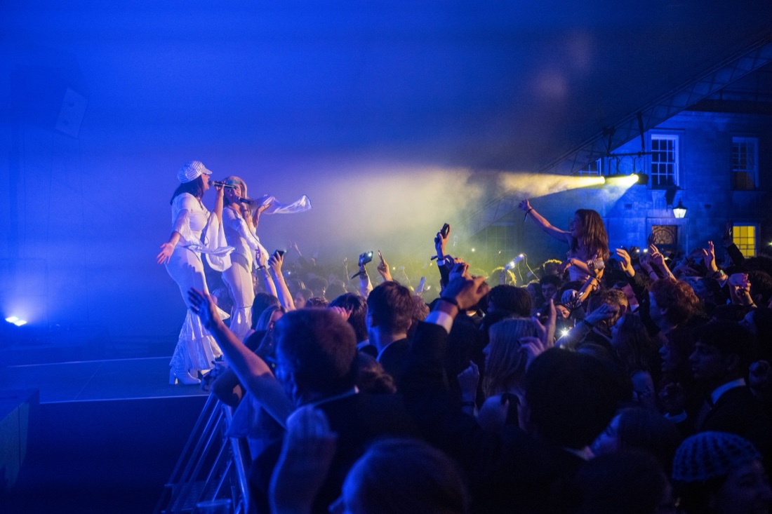 The band playing to a full marquee with the crowd pressed against the stage